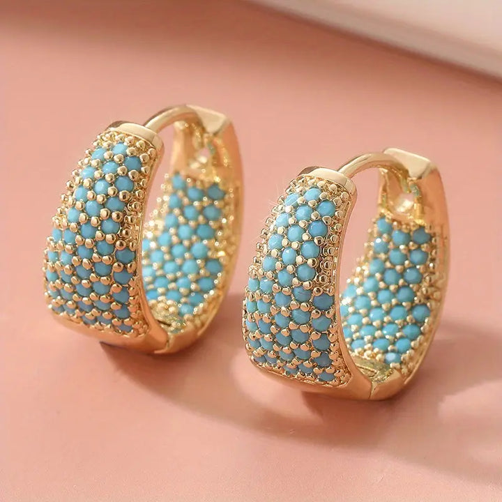 Boucles d'oreilles créoles élégantes en or avec des perles turquoise