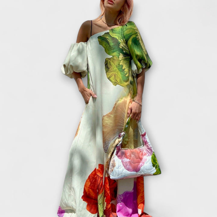 Skylar - Maxi robe à imprimé floral, décolleté asymétrique et manches bouffantes