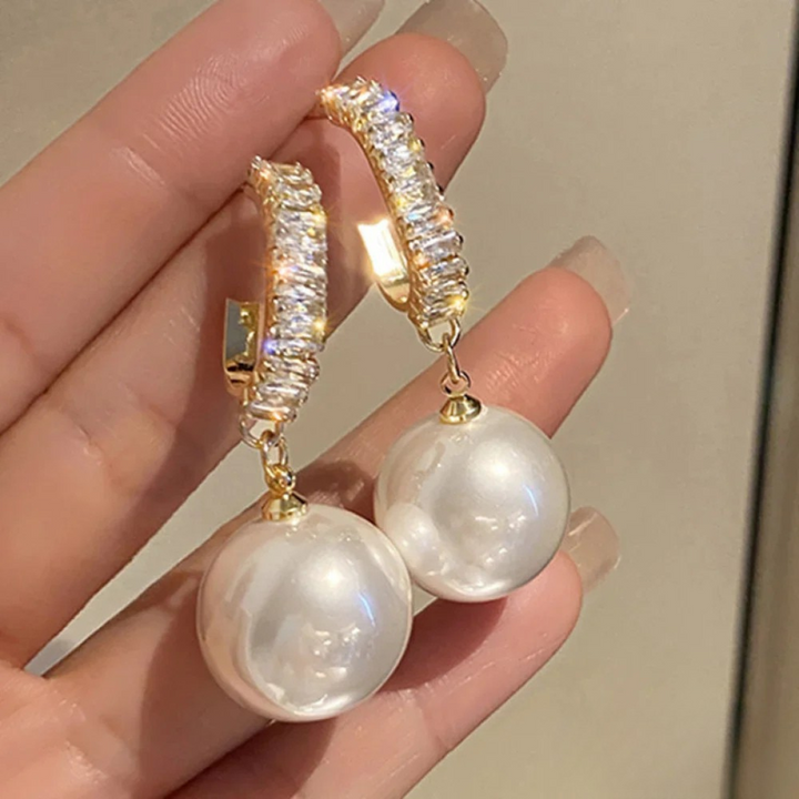 Boucles d'oreilles chiques avec perle et zircon