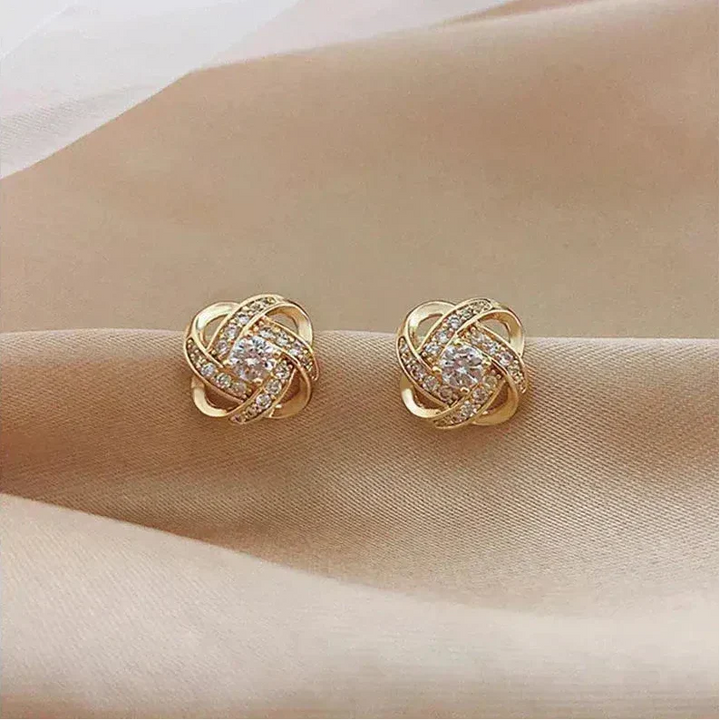 Boucles d'oreilles en spirale dorées avec des cristaux
