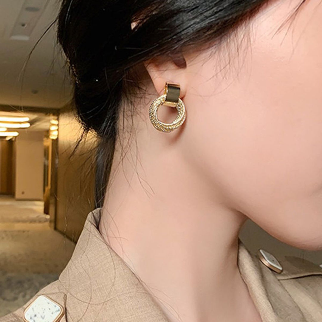 PAIRE DE BOUCLES D'OREILLES EN CORDON