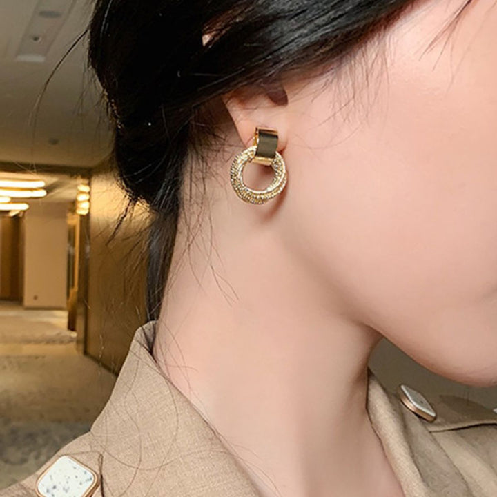 PAIRE DE BOUCLES D'OREILLES EN CORDON