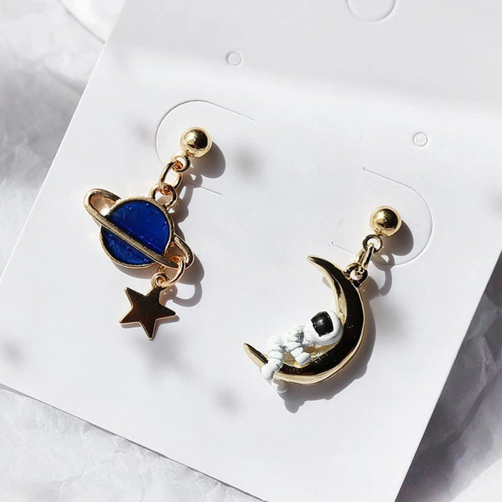 BOUCLES D'OREILLES ASTRONAUTE ET PLANÈTE (ENSEMBLE)