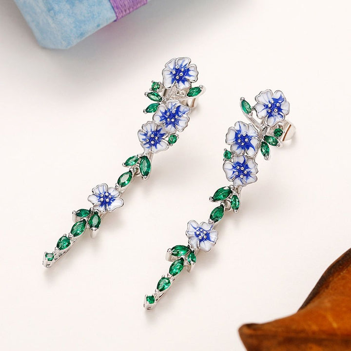 PAIRE DE BOUCLES D'OREILLES EN CHAÎNE AVEC FLEUR BLEUE