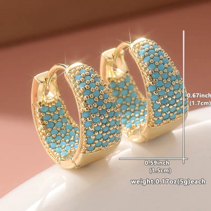 Boucles d'oreilles créoles élégantes en or avec des perles turquoise