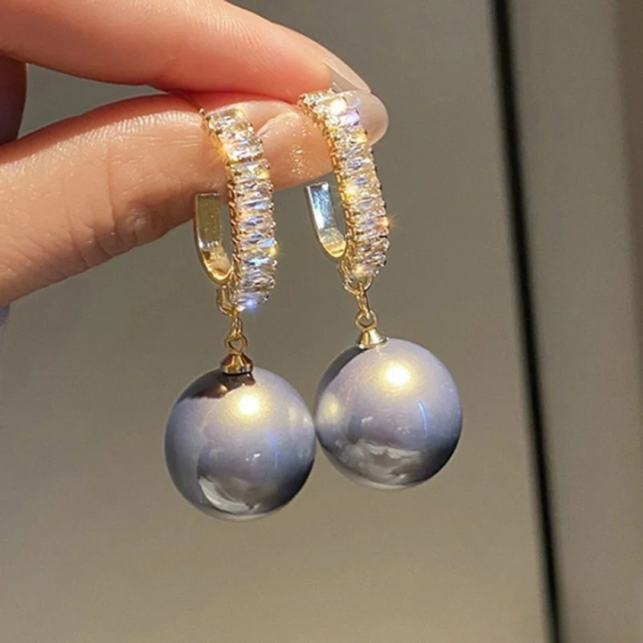 Boucles d'oreilles chiques avec perle et zircon