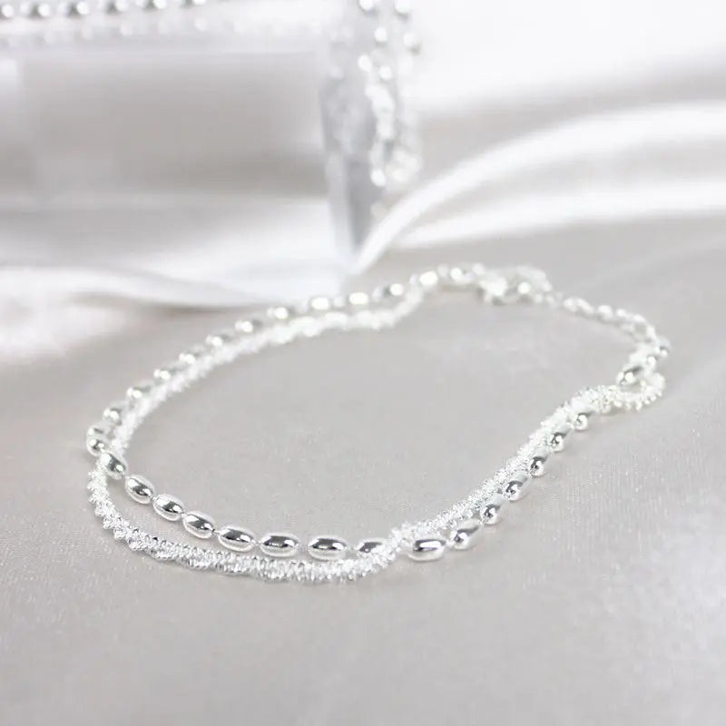 Élégant ensemble de bracelets en argent avec des pierres de zirconium