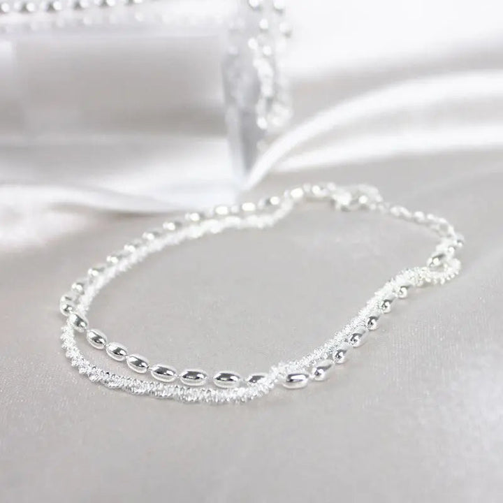 Élégant ensemble de bracelets en argent avec des pierres de zirconium