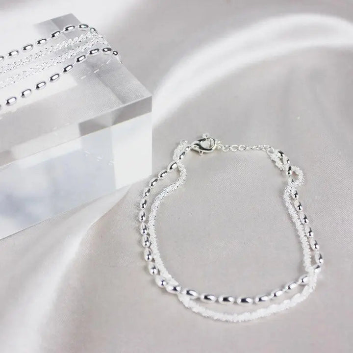 Élégant ensemble de bracelets en argent avec des pierres de zirconium