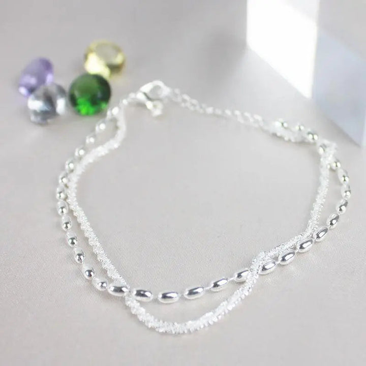 Élégant ensemble de bracelets en argent avec des pierres de zirconium