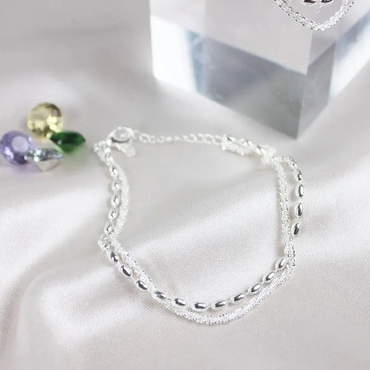 Élégant ensemble de bracelets en argent avec des pierres de zirconium