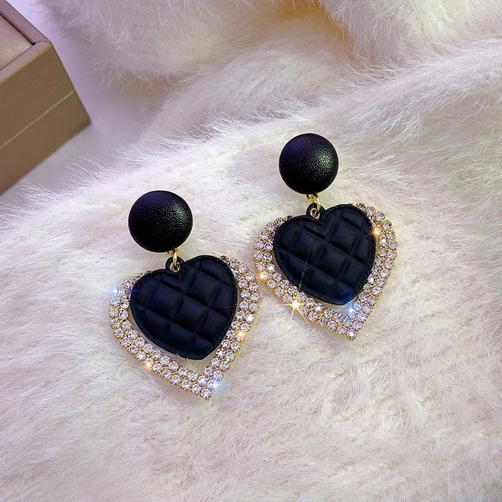 Boucles d'oreilles en forme de cœur noires en or