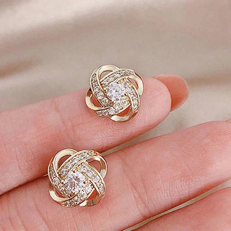 Boucles d'oreilles en spirale dorées avec des cristaux