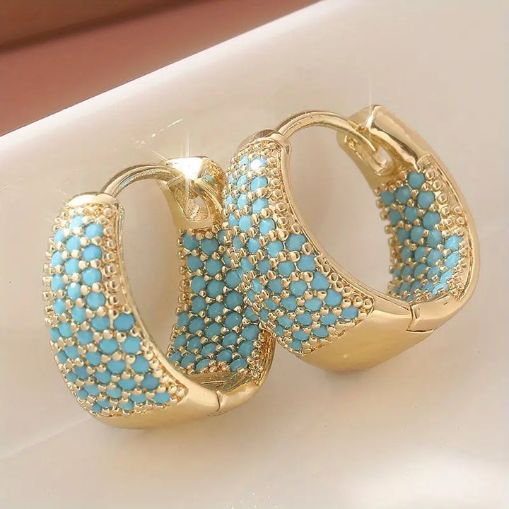 Boucles d'oreilles créoles élégantes en or avec des perles turquoise