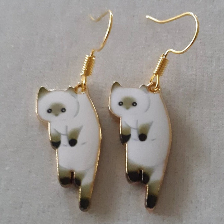 PAIRE DE BOUCLES D'OREILLES PENDANTES EN FORME DE CHATONS