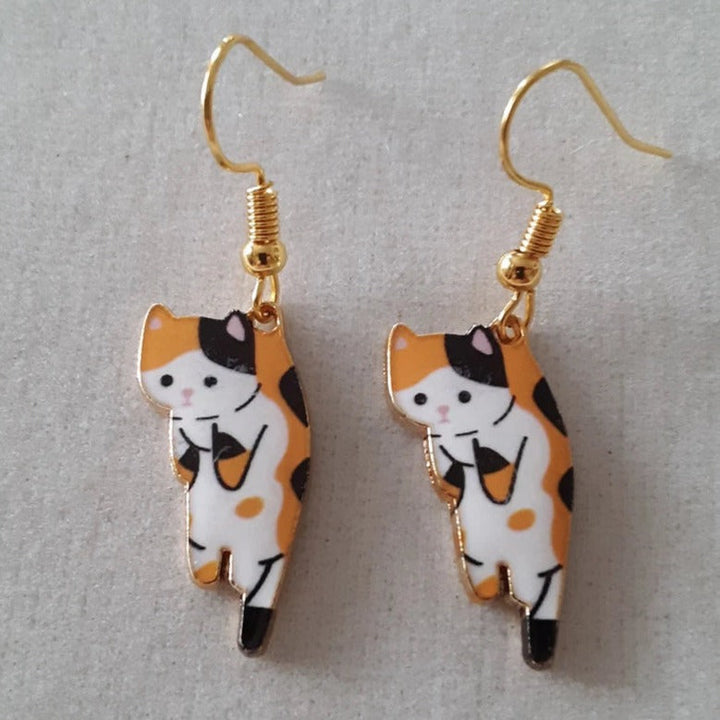 PAIRE DE BOUCLES D'OREILLES PENDANTES EN FORME DE CHATONS
