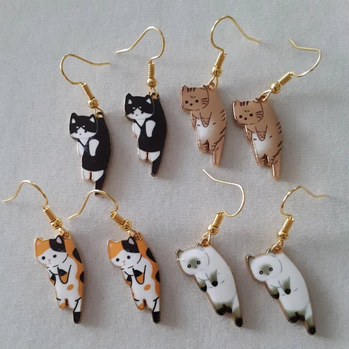 PAIRE DE BOUCLES D'OREILLES PENDANTES EN FORME DE CHATONS
