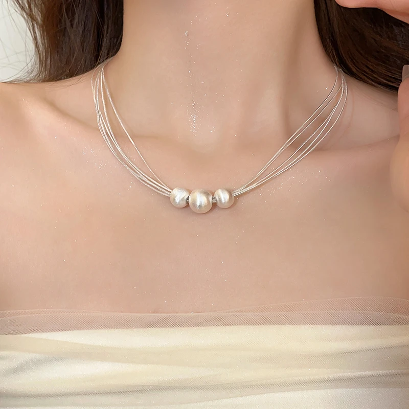 Collier Élégant à Couches avec Perle Blanche