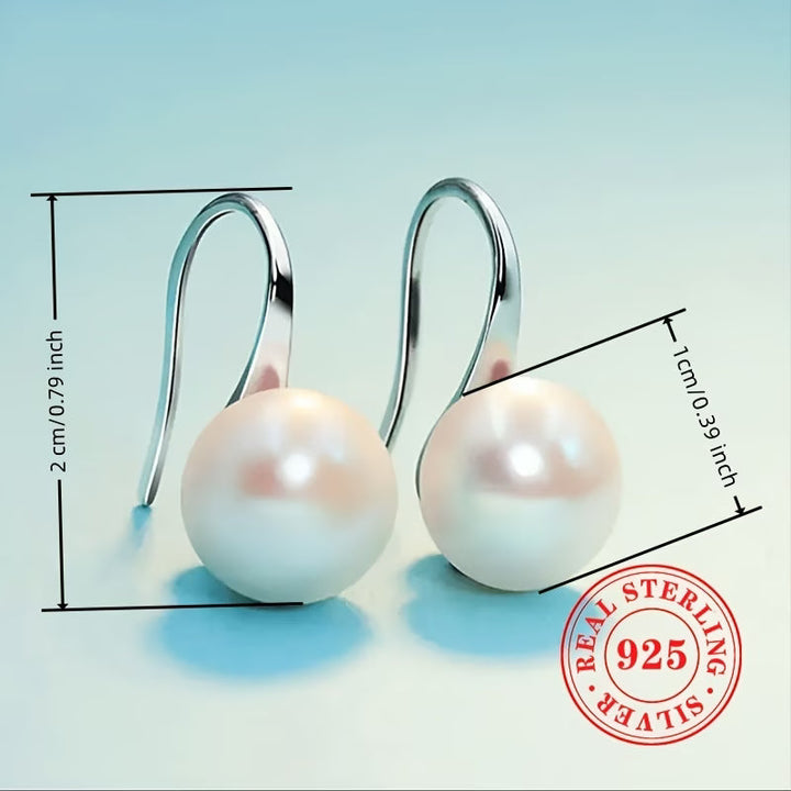 Les Boucles d'Oreilles Perle Signature